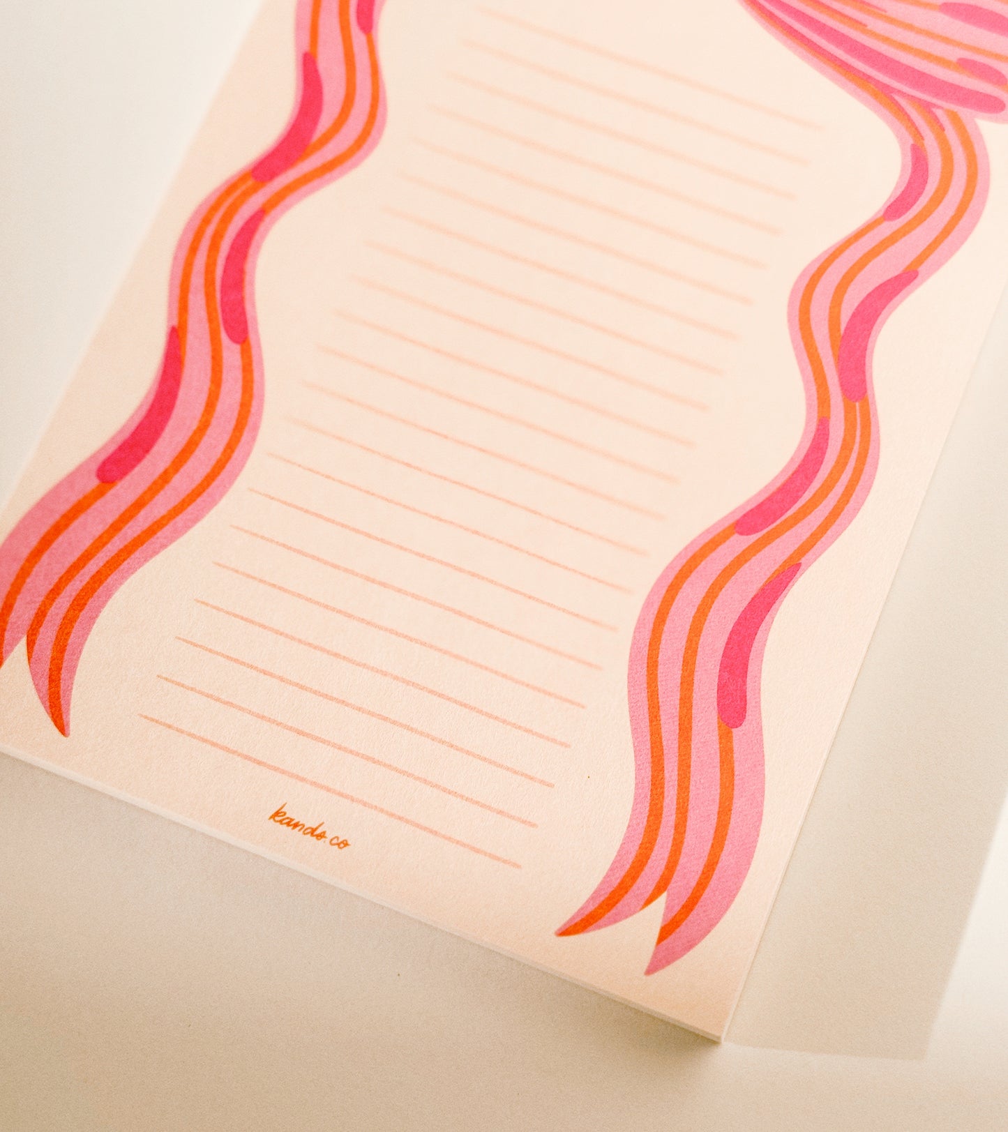 Detail shot of little bow pink notepad showing cute design