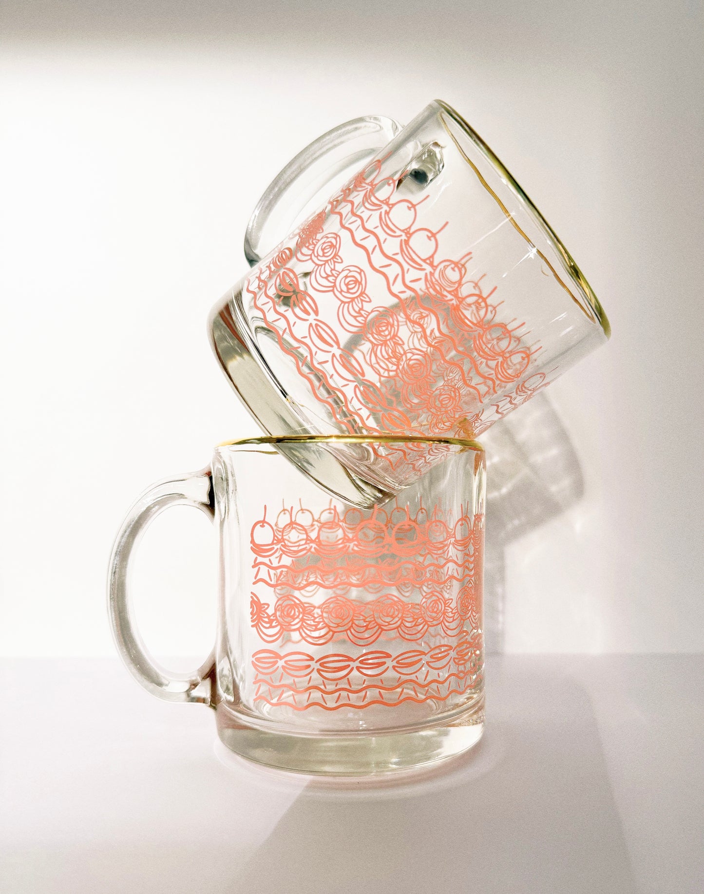 Clear glass mug with cake frosting design and sweet theme