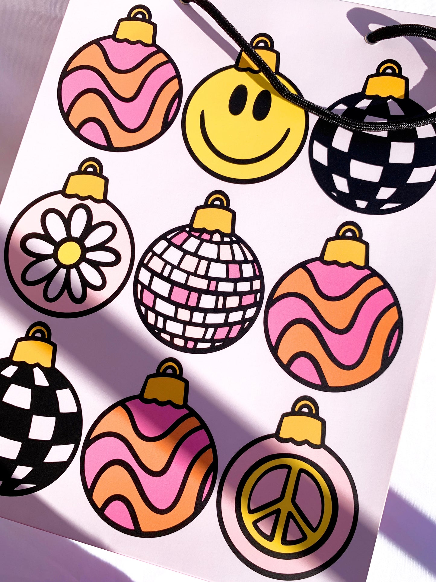 Side view of groovy ornament gift bag with festive pattern