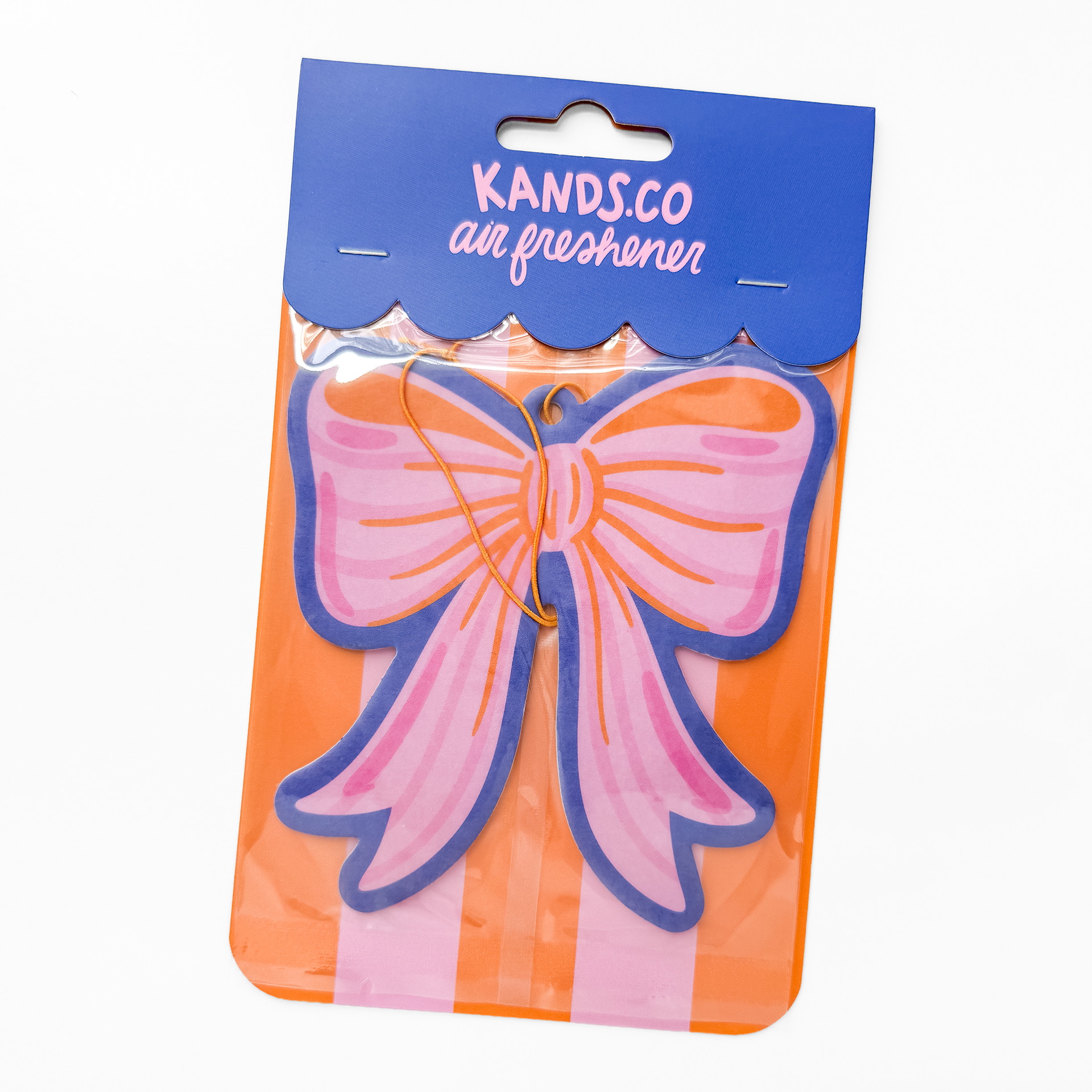 Packaged pink bow air freshener in clear packaging