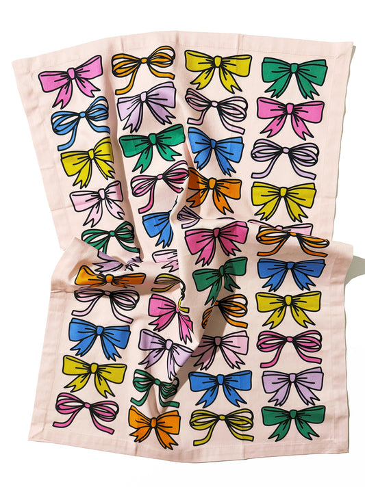 Kitchen tea towel with festive gift bow pattern design