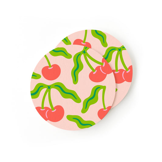 Fruit-themed coasters with cherry pattern and red accent design