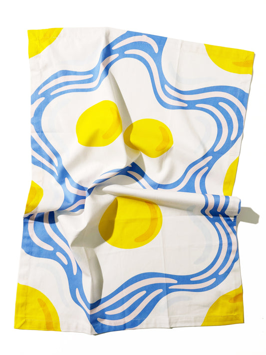 Kitchen tea towel with 'Eggs-pressive' pun and egg illustrations