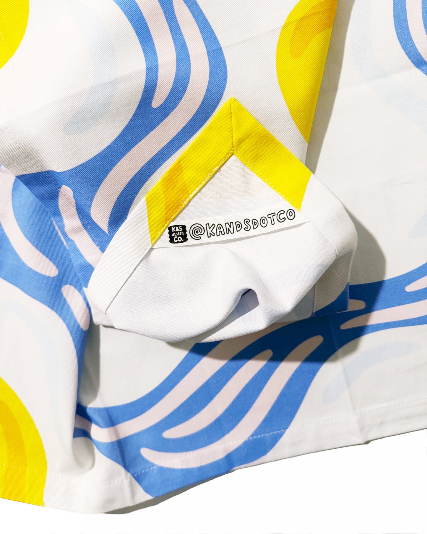 Detail of eggs-pressive tea towel with cute egg character design