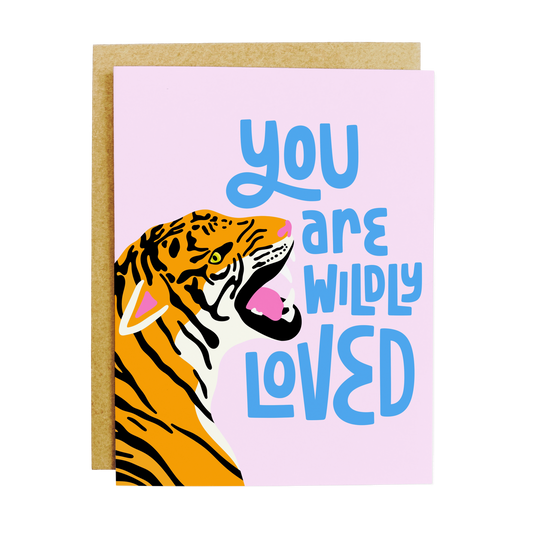 Greeting card featuring floral design with 'Wildly Loved' message in elegant lettering