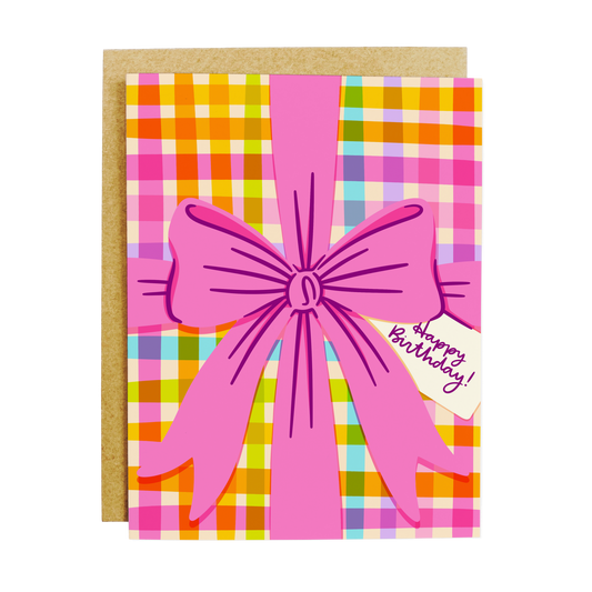 Birthday card with gift bow design and 'Happy Birthday' festive text
