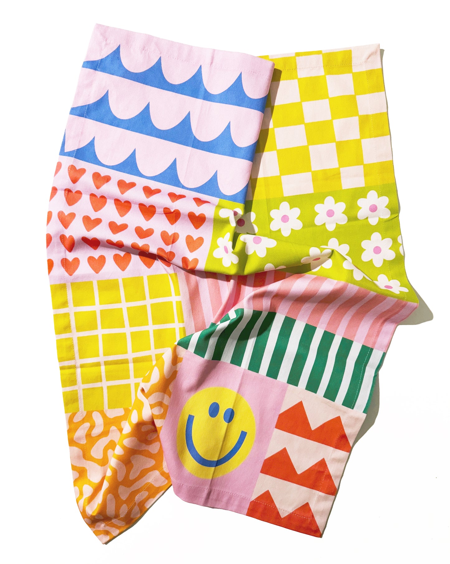 Colorful tea towel with happy quilt pattern and cheerful design