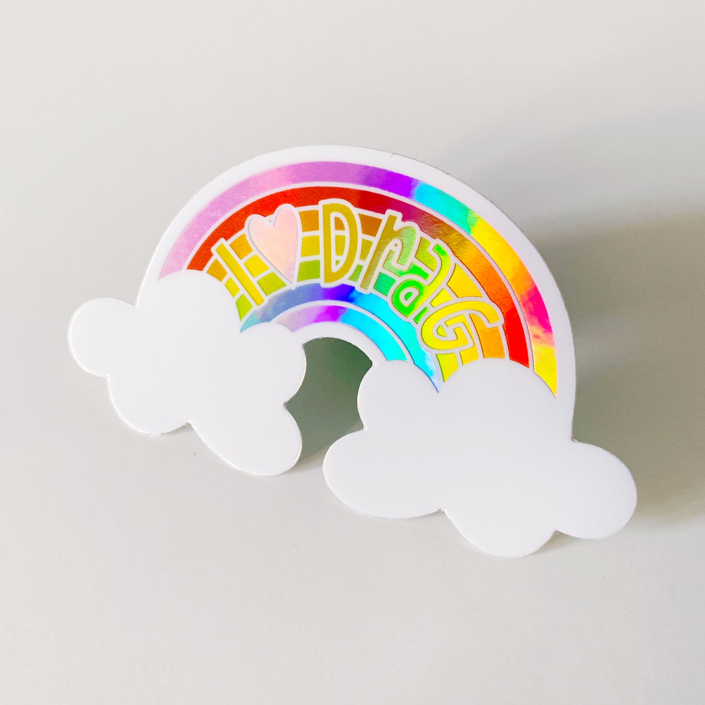 Close-up of I Heart Drag rainbow sticker showing LGBTQ+ support