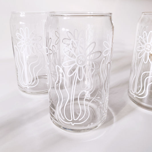 Drinking glass with moody floral design in dark botanical style