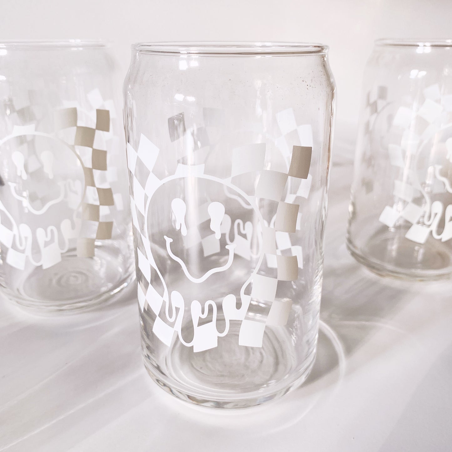 Alternative view of drippy smiley can glass showing unique shape