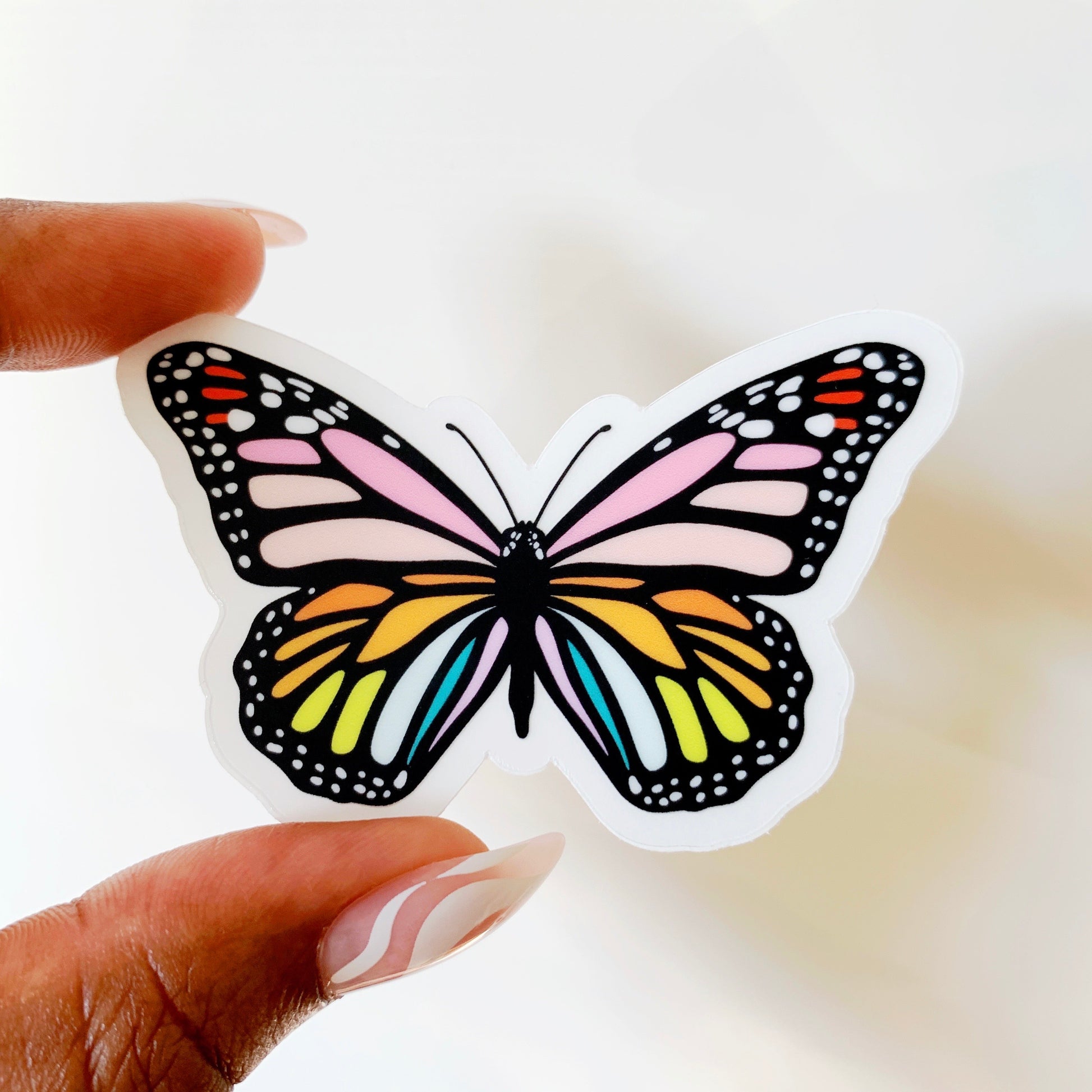Rainbow butterfly sticker showing detailed colorful wing pattern