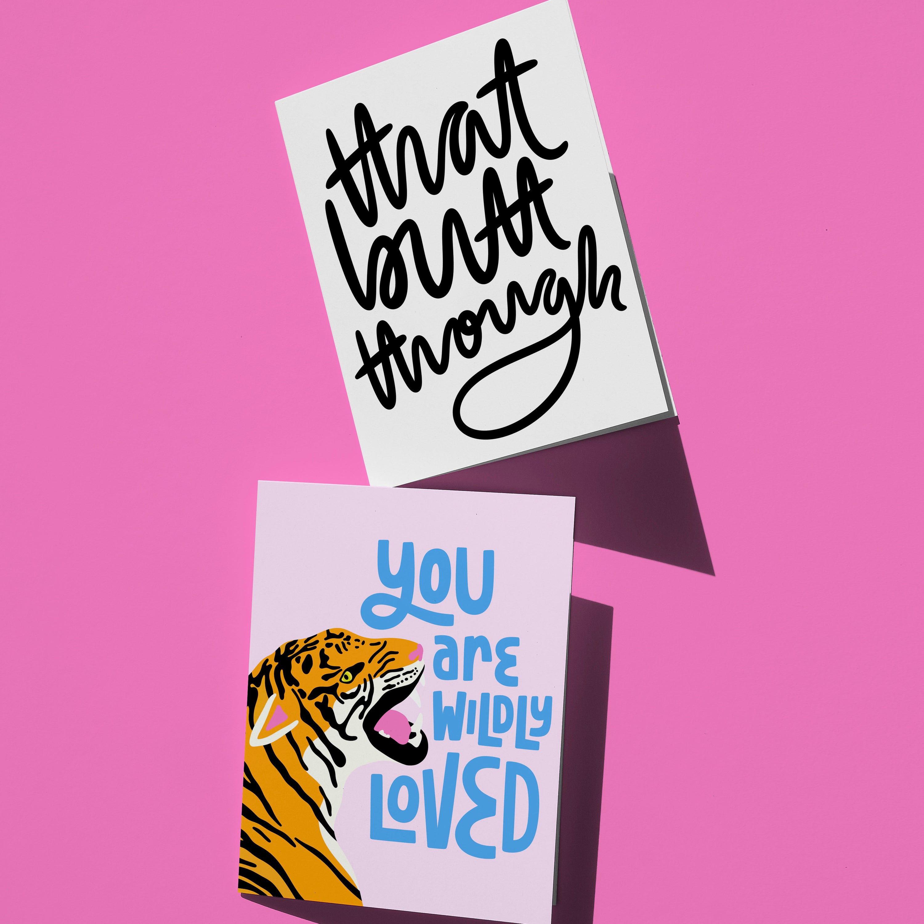 that butt through hand-lettered card, wildly loved lettered in blue card on pink background with tiger