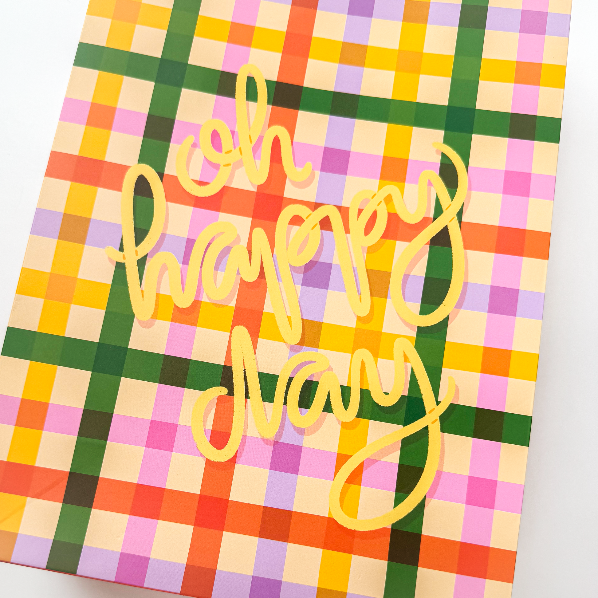 Close-up of pasta noodle design and 'Oh Happy Day' lettering on gift bag
