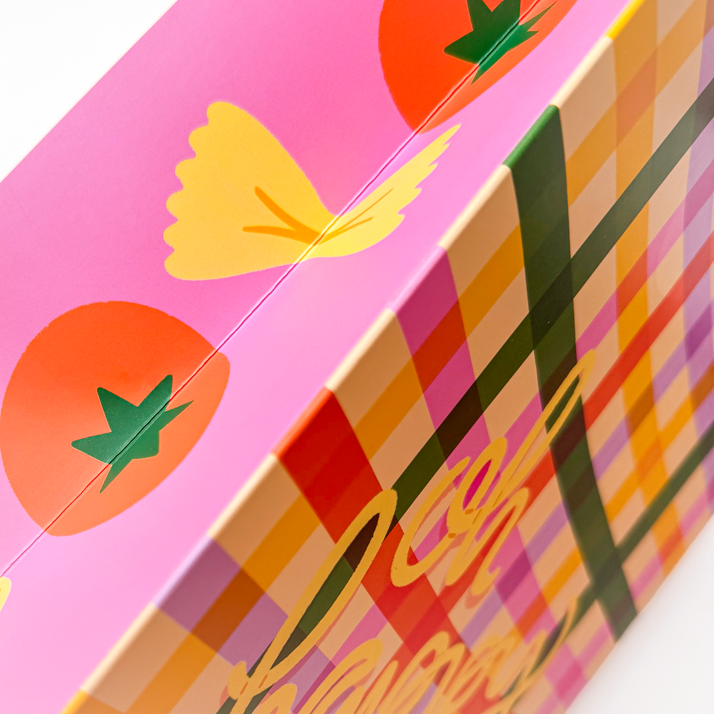 Detail view of colorful pasta illustrations on Oh Happy Day gift bag