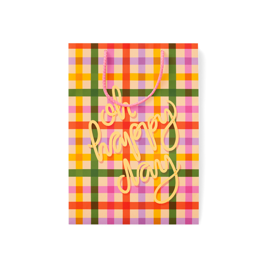 plaid gift bag with pasta noodle illustrations and 'Oh Happy Day' text with rope handles