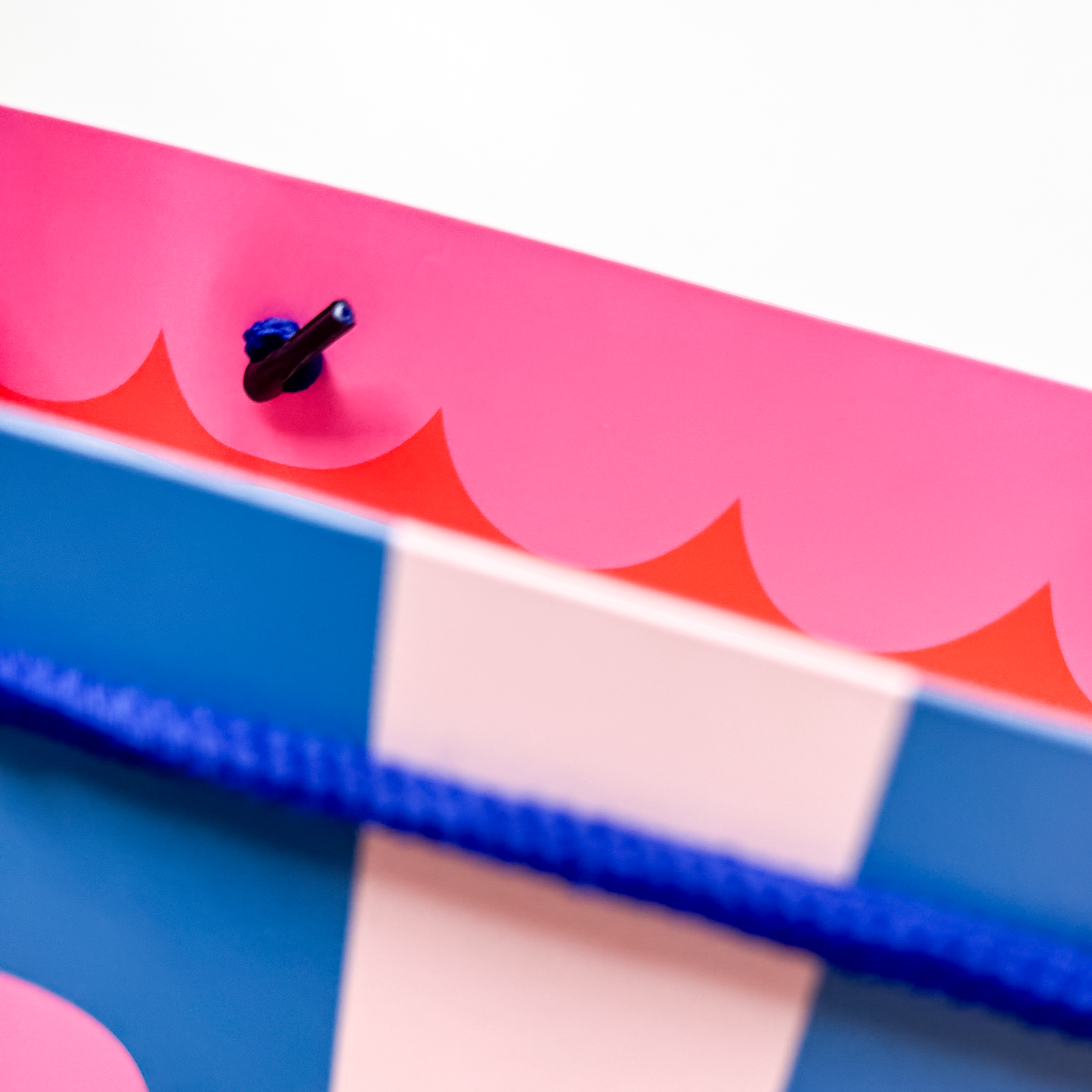 Detail view of celebrate gift bag featuring colorful hand-lettered design