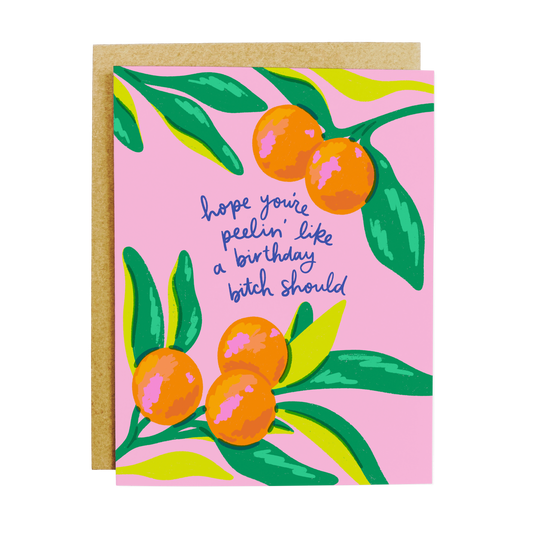 Humorous birthday card with orange illustrations and 'Peelin' Good Like a Birthday Bitch Should' text