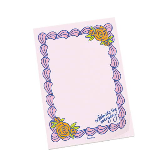 Notepad with decorative cake border and floral elements on a white background
