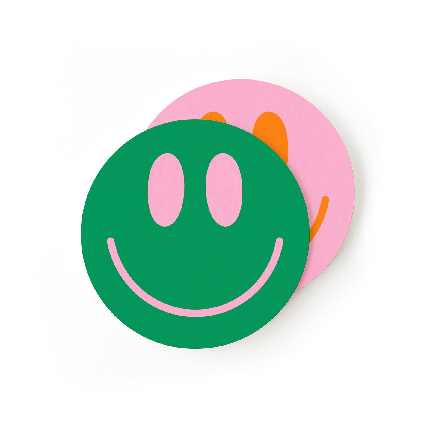 Smile face coasters arranged showing happy face pattern