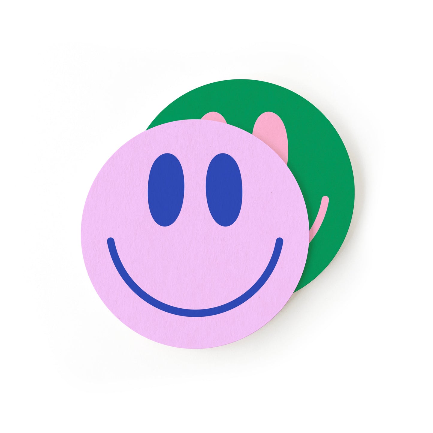 Close-up of smile face coaster with classic yellow emoji design